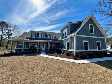 Modern inspired farmhouse with board and batten si