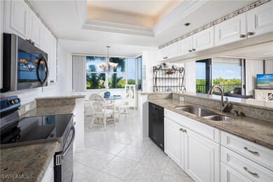Kitchen featuring stainless steel electric range,