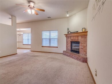 Large open living area with Brick fireplace that h