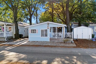 View of front facade with a shed