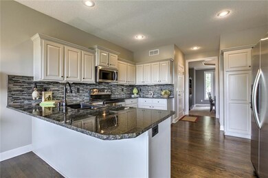 Beautiful light cabinets with granite countertops,