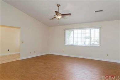 The living room is located just off of the entry, 