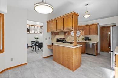 Main level: kitchen with new stainless appliances and LVT flooring