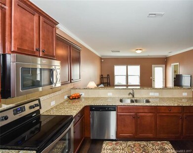 Granite counter tops, ceramic tile back splash, SS