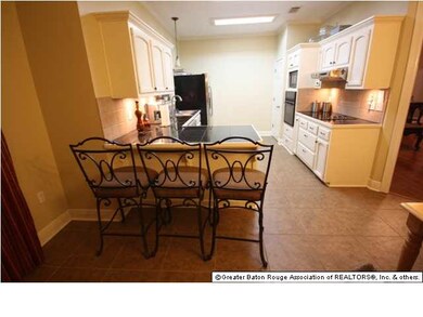 View of kitchen from breakfast area