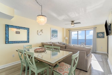 Dining space featuring ceiling fan with notable ch