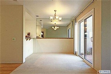 DINING ROOM W/ VIEW TO BACKYARD.