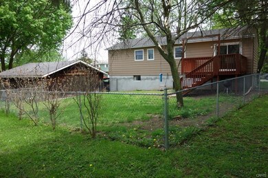 Fenced in back yard with deck!