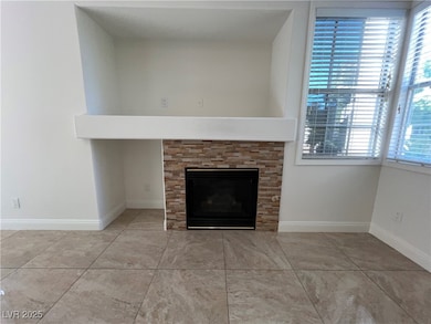 Detailed view of a fireplace and baseboards