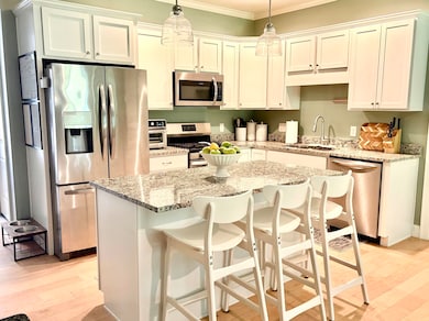 Eat-in kitchen with granite and stainless appliances