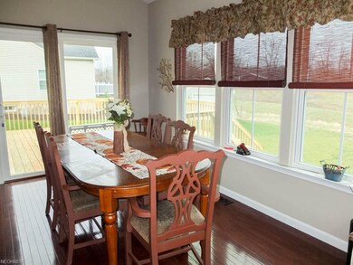 Beautiful morning room with wood flooring is open 