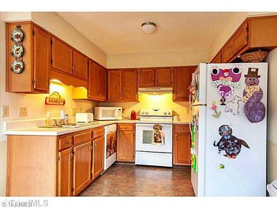 Kitchen. Bright and cheery  kitchen features newer appliances and lots of cabinet space!