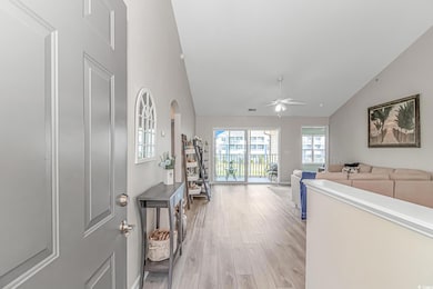 Interior space featuring arched walkways, light wo
