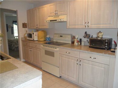 Kitchen. Neat and clean with ample cabinets and co