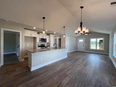 Kitchen with white cabinets, stainless steel appli