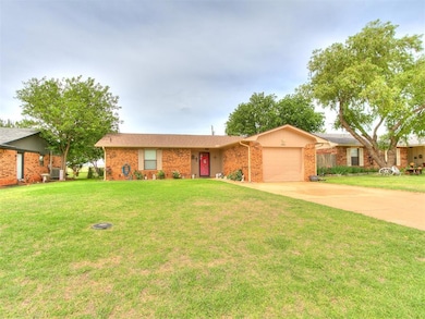 Ranch-style home featuring an attached garage, dri