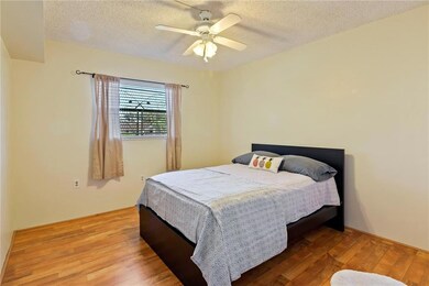 SECOND BEDROOM WITH LAMINATE FLOORING AND CEILING
