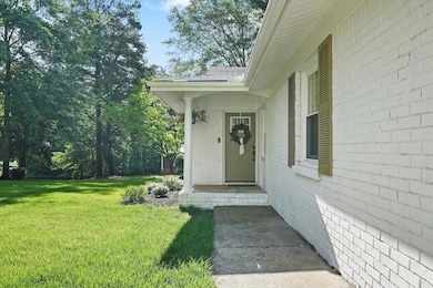 Get ready to fall in love! Family and friends are welcomed with the pretty limewashed brick   exterior, new front door and front porch lighting.