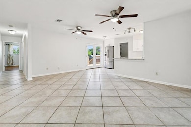 Den is large enough to fit a great sized sofa and entertainment area. Open to the kitchen.