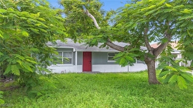 View of front of property featuring a front yard and roof with shingles