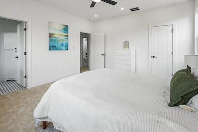 Bedroom featuring carpet flooring, recessed lighting, and a ceiling fan