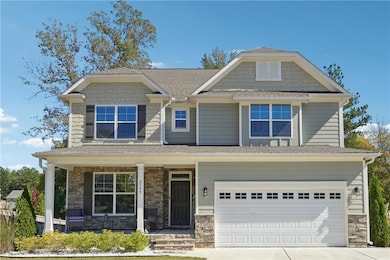 Craftsman house featuring a garage