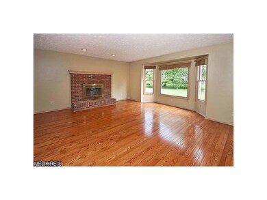 Family Room with fireplace and great bay window to