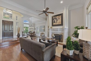 Comfortable living room with see through fireplace and extensive wood trim.