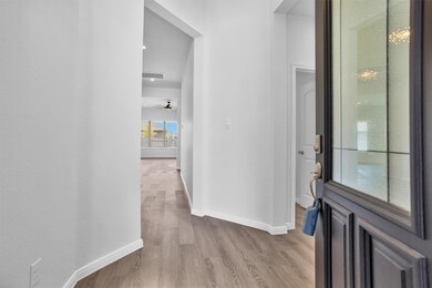 Step inside to a welcoming foyer with luxury vinyl