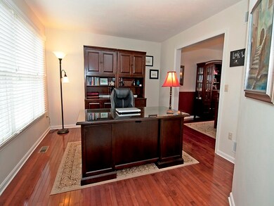 First floor office/living room with gleaming hardw