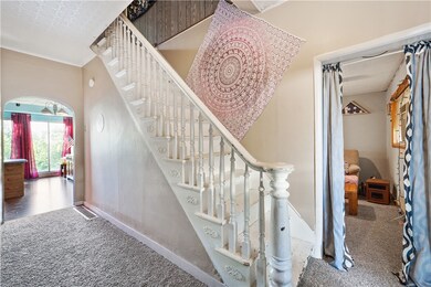 Large entry way with brand new carpet, light & bri