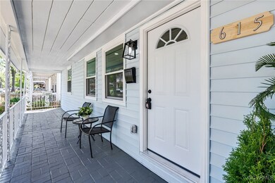 View of exterior entry featuring a porch