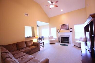 Soaring ceilings with recessed lighting and a wood burning fireplace to enjoy on those chilly evenings.