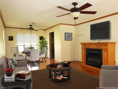 The living room features a gas fireplace and has a