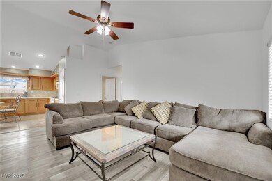Living area with lofted ceiling, recessed lighting