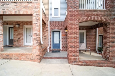 Entrance to property with brick siding