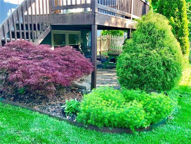 Colorful, lush landscaping providing privacy aroun
