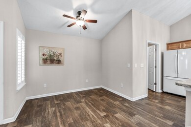 Empty room with dark hardwood / wood-style floors,