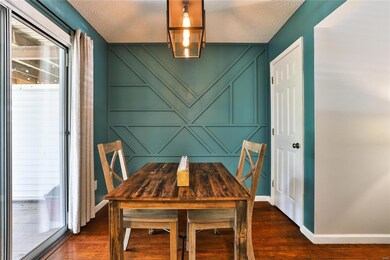 Breakfast room with cool accent wall and storage c