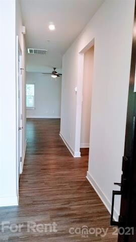 Entrance hall leading back to the common areas and master bedroom.  Garage entrance & mud room to the right at opening.
