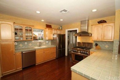 The remodeled kitchen is big & open, with bar coun
