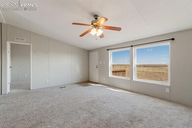Spare room featuring lofted ceiling, light colored