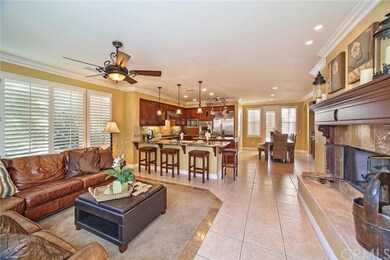 Open great room with crown molding, recessed light