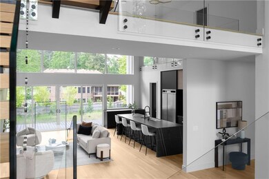 Living room with a high ceiling and light wood-typ