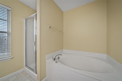 Owner's bathroom offers separate soaking tub/showe