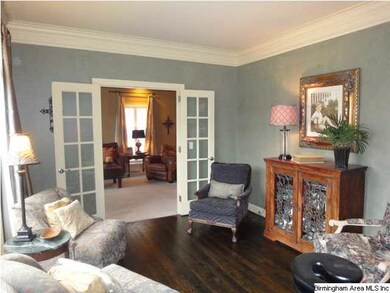 Formal living room separates family room with Fren
