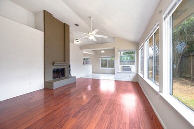 Gather the family and guests together in your huge living room! Featuring soaring high ceilings, gorgeous floors, cozy brick fireplace, and large windows that provide plenty of natural lighting throughout the day!
