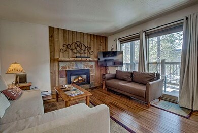 Living Room with wood floors, fireplace and slidin