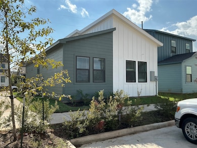 Back of Home where parking spaces are available....