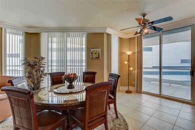 Dining space with light tile patterned floors, bas